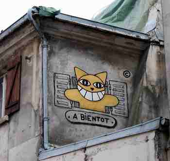 Yellow cat graffiti on Montmartre.