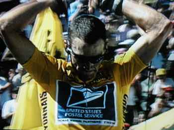 The formidable Lance Armstrong, cancer surviver, crossing the finish line.