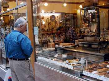 Tom examines the pastries in the window of a tea shop where we decided to have coffee.