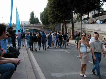 People walking along Paris Beach.  It seemed like a wide, long, crowded boardwalk.