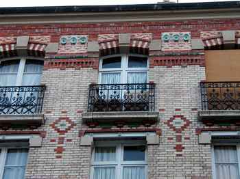 Terra cotta decorations on rue du Theatre.