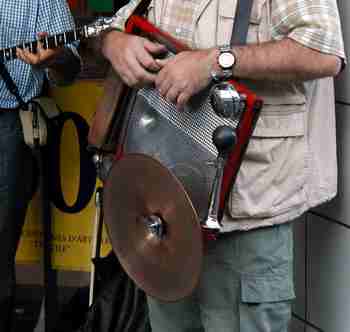 Percussionist plays washboard like instrument in dixieland jazz group.